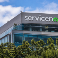 ServiceNow logo displayed on the exterior of a modern office building.