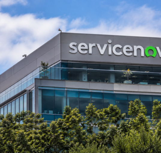 ServiceNow logo displayed on the exterior of a modern office building.