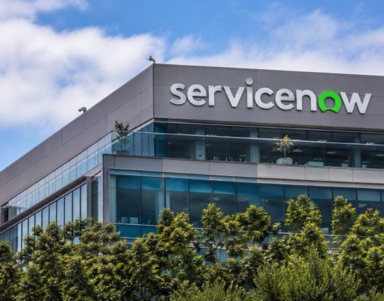 ServiceNow logo displayed on the exterior of a modern office building.