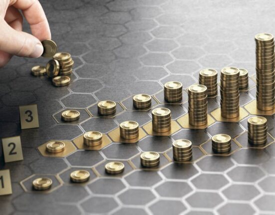 hand stacks coins