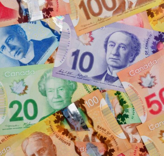Pile of Canadian dollar bills in various denominations