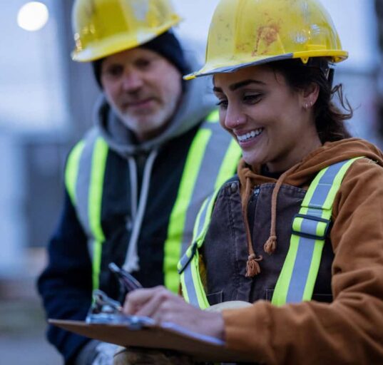 construction workers talk on the job site