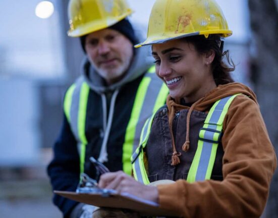 construction workers talk on the job site