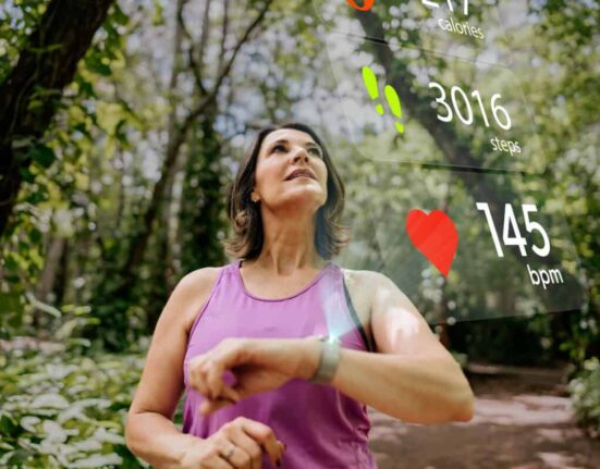 runner checks her biodata on smartwatch