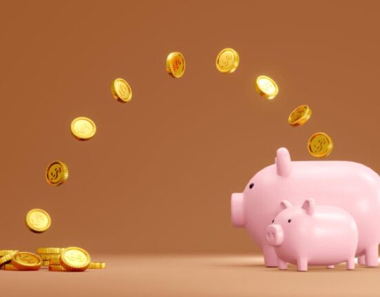 coins jump into piggy bank