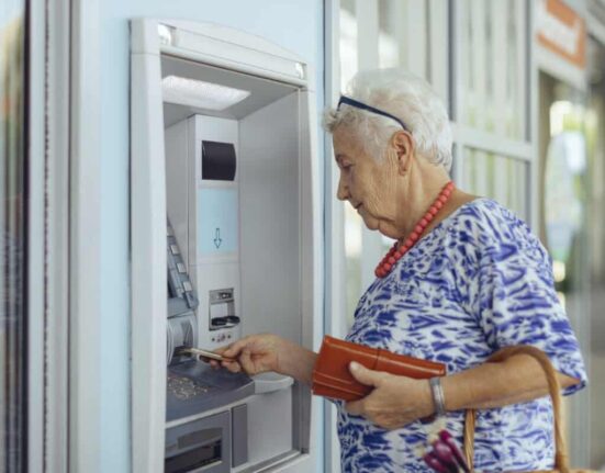 customer uses bank ATM